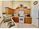 Updated kitchen with granite counters and wood cabinetry at 3789 Lakewood Blvd, North Port, FL 34287