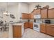 Modern kitchen featuring granite countertops and stainless steel appliances at 3789 Lakewood Blvd, North Port, FL 34287