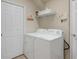Laundry room with washer, dryer, and additional storage at 3789 Lakewood Blvd, North Port, FL 34287