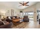 Living room with view of lake from sliding glass doors at 3789 Lakewood Blvd, North Port, FL 34287