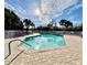 Community pool with a spacious deck area for relaxation at 3789 Lakewood Blvd, North Port, FL 34287