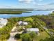 Expansive aerial view of coastal home, showcasing stunning waterfront scenery and lush surroundings at 38 Riverfront Dr, Venice, FL 34293
