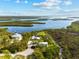 Stunning aerial home with a large backyard, beautiful landscaping and adjacent private dock at 38 Riverfront Dr, Venice, FL 34293