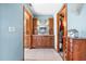 Bathroom featuring matching cabinetry with granite countertops, tiled floors, and a closet at 38 Riverfront Dr, Venice, FL 34293