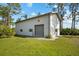 The property's exterior showcases a two-car garage with a gray door and white stucco siding at 38 Riverfront Dr, Venice, FL 34293