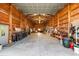 The open garage interior is a workshop with exposed beams and a metal roof at 38 Riverfront Dr, Venice, FL 34293