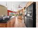 Spacious kitchen featuring black countertops, tile flooring, and stainless steel appliances at 38 Riverfront Dr, Venice, FL 34293
