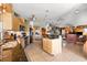 Open-concept kitchen with island, stainless steel appliances, and breakfast bar at 38 Riverfront Dr, Venice, FL 34293