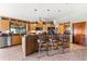 Modern kitchen featuring stainless steel appliances and a breakfast bar with seating at 38 Riverfront Dr, Venice, FL 34293