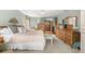 This main bedroom is decorated with carpet, a ceiling fan, and furnishings with traditional designs at 38 Riverfront Dr, Venice, FL 34293