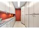 Well-organized pantry with ample storage space and clean neutral counters at 38 Riverfront Dr, Venice, FL 34293