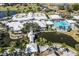 Aerial view of community clubhouse, pool, and golf course at 450 Wexford Cir # 106, Venice, FL 34293