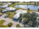 Community view showcasing homes, landscaping, and lake at 450 Wexford Cir # 106, Venice, FL 34293