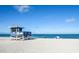 Lifeguard stand on pristine beach with clear water at 450 Wexford Cir # 106, Venice, FL 34293