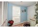 Light blue walls and tiled floor, with white built-in storage at 450 Wexford Cir # 106, Venice, FL 34293
