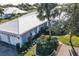 Single-story home with two-car garage and landscaped yard at 450 Wexford Cir # 106, Venice, FL 34293