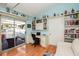 Bright home office with built-in shelves and patio access at 450 Wexford Cir # 106, Venice, FL 34293