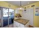 Bright kitchen with granite countertops and island at 450 Wexford Cir # 106, Venice, FL 34293