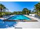Community swimming pool with lounge chairs at 450 Wexford Cir # 106, Venice, FL 34293