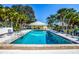 Community pool with plenty of lounge chairs at 450 Wexford Cir # 106, Venice, FL 34293