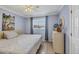 Bright bedroom with a comfortable bed and dresser at 460 Base E Ave # 113, Venice, FL 34285