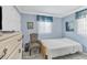Guest bedroom with a bed and chair at 460 Base E Ave # 113, Venice, FL 34285