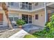 Inviting entryway with a paved walkway and tropical landscaping at 460 Base E Ave # 113, Venice, FL 34285
