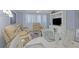 Comfortable living room featuring a neutral color palette and ample seating at 460 Base E Ave # 113, Venice, FL 34285