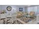 Light and airy living room with comfortable seating and a dining area at 460 Base E Ave # 113, Venice, FL 34285