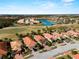 Aerial view of community with golf course and lake at 482 Montelluna Dr, North Venice, FL 34275