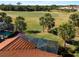 Aerial view showcasing a home's pool, landscaping, and golf course view at 482 Montelluna Dr, North Venice, FL 34275