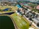 Aerial view of golf course clubhouse and parking lot at 482 Montelluna Dr, North Venice, FL 34275