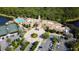 Aerial view of community amenities including pool, tennis, and parking at 482 Montelluna Dr, North Venice, FL 34275