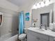 Clean bathroom with white vanity and blue accents at 482 Montelluna Dr, North Venice, FL 34275
