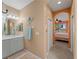 Bathroom with vanity and view to bedroom at 482 Montelluna Dr, North Venice, FL 34275