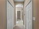 Bathroom hallway with two closets and access to bathroom at 482 Montelluna Dr, North Venice, FL 34275