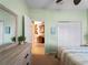 Bedroom with dresser and view to hallway at 482 Montelluna Dr, North Venice, FL 34275