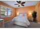 Bright bedroom with orange walls and a comfy bed at 482 Montelluna Dr, North Venice, FL 34275