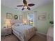 Bedroom with light green walls and wood bed frame at 482 Montelluna Dr, North Venice, FL 34275