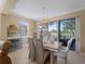Bright dining room with chandelier and view of golf course at 482 Montelluna Dr, North Venice, FL 34275