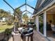 Enclosed patio with seating area and view of golf course at 482 Montelluna Dr, North Venice, FL 34275