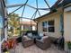Covered patio with seating area and golf course view at 482 Montelluna Dr, North Venice, FL 34275