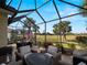 Enclosed patio boasts golf course views and seating at 482 Montelluna Dr, North Venice, FL 34275
