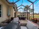 Spacious covered patio with multiple seating areas at 482 Montelluna Dr, North Venice, FL 34275