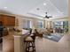 Open kitchen features granite countertops, stainless steel appliances, and custom cabinetry at 482 Montelluna Dr, North Venice, FL 34275