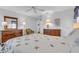 Bright bedroom with a comfortable bed and wood furniture at 507 Foxwood Blvd # 4, Englewood, FL 34223