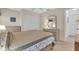 Spacious bedroom with a queen bed, dresser, and large closet at 507 Foxwood Blvd # 4, Englewood, FL 34223