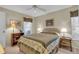 Well-lit bedroom featuring a comfortable double bed and built-in shelves at 507 Foxwood Blvd # 4, Englewood, FL 34223