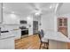 Modern kitchen featuring white cabinets and granite countertops at 507 Foxwood Blvd # 4, Englewood, FL 34223