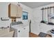 Functional laundry room, washer, dryer, and storage cabinets at 507 Foxwood Blvd # 4, Englewood, FL 34223